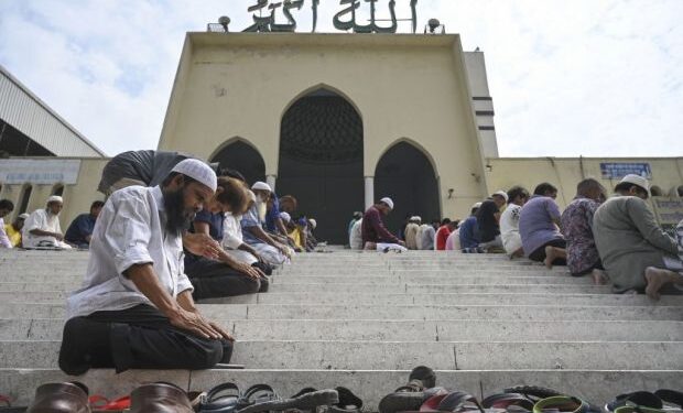 Bangladeshi Muslims offer Friday prayers after protesting against attacks on two mosques in New Zealand, in Dhaka on March 15, 2019. - Attacks on two Christchurch mosques left at least 49 dead on March 15, with one gunman -- identified as an Australian extremist -- apparently livestreaming the assault that triggered the lockdown of the New Zealand city. (Photo by MUNIR UZ ZAMAN / AFP)        (Photo credit should read MUNIR UZ ZAMAN/AFP/Getty Images)