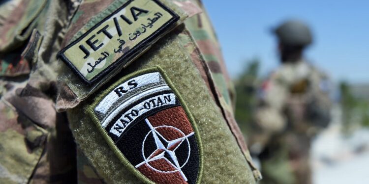 A German soldier from the NATO coalition stands guard during a visit by resolute support spokesman Brigadier General H. Cleveland outside the Shaheen 209th military corps training center in Mazar-i-Sharif on April 26, 2016. 
There are around 13,000 NATO troops stationed in Afghanistan, officially in a training and advisory role since the end of their combat mission in 2014.  / AFP / WAKIL KOHSAR        (Photo credit should read WAKIL KOHSAR/AFP/Getty Images)