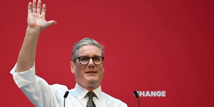 Britain's main opposition Labour Party leader Keir Starmer delivers a speech on stage during the launching of Labour Party election manifesto, in Manchester, on June 13, 2024 in the build-up to the UK general election on July 4. (Photo by Oli SCARFF / AFP)